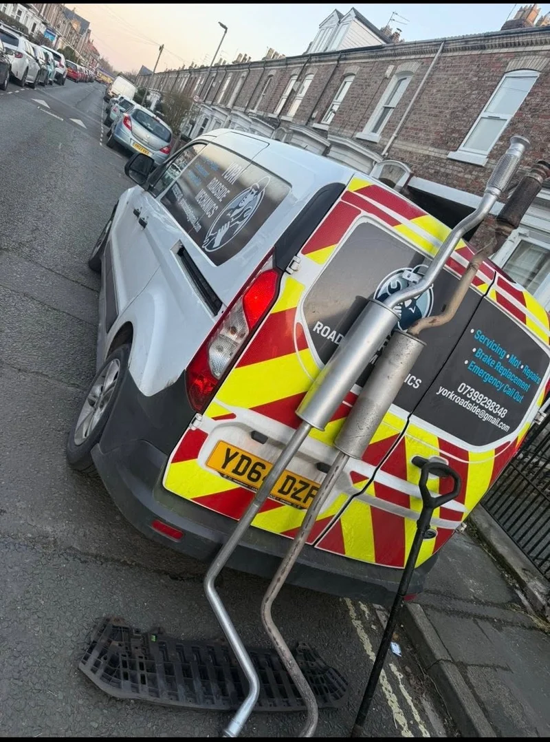 York Roadside Mechanics technician replacing an exhaust system on a vehicle in York